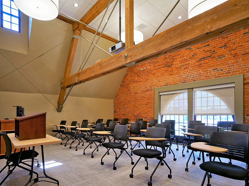 Renovated classroom with exposed brick and wood beams in Glatfelter Hall at Gettysburg College