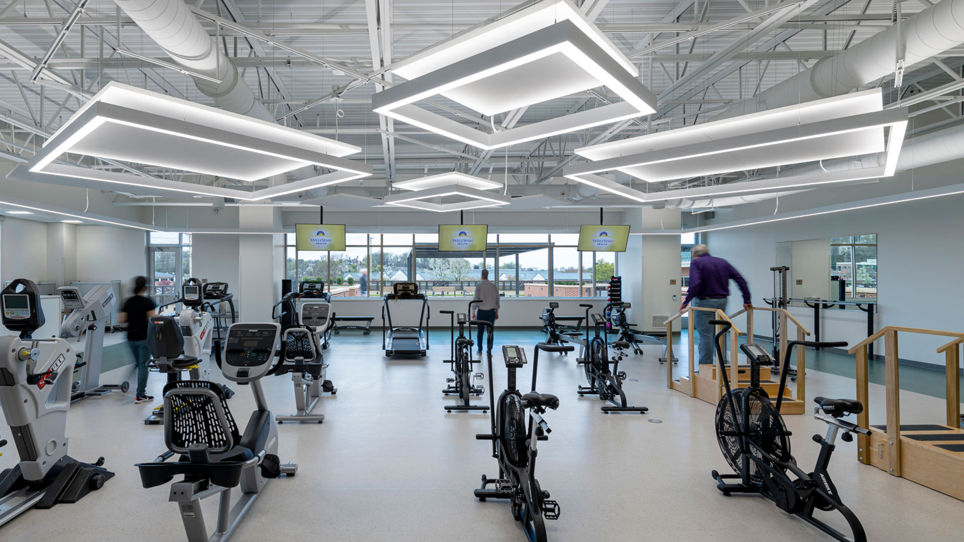 Cardiac rehabilitation gym with exercise equipment and suspended LED lighting at WellSpan Heart and Vascular Center