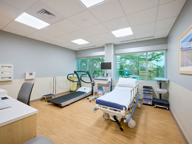 Cardiac exam room with hospital bed and rehabilitation treadmill at UPMC Outpatient Center