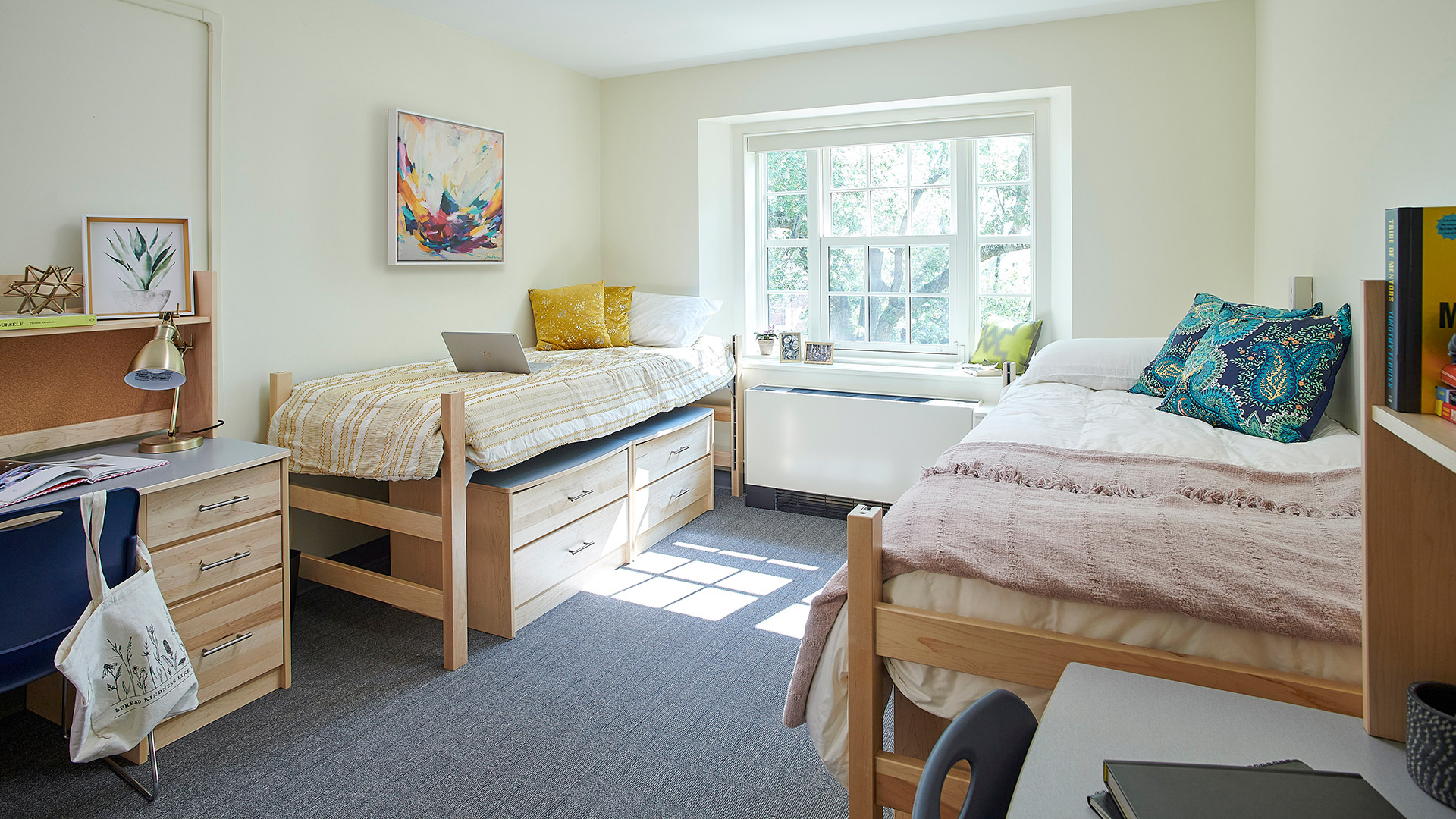 Renovated double dorm room at Dickinson College Drayer Hall featuring modern furniture, under-bed storage, study desks, and updated lighting