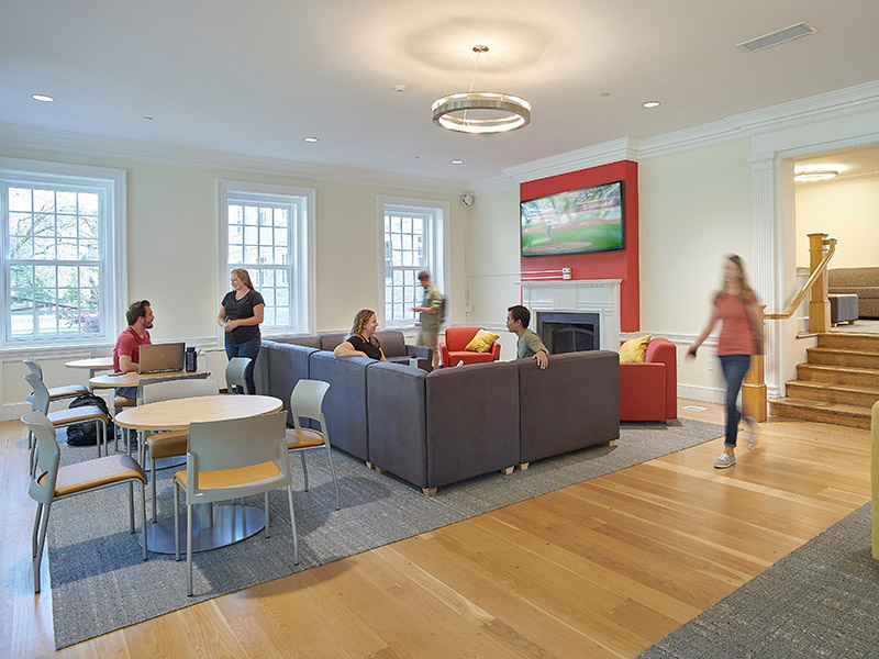 Renovated student lounge in Dickinson College Drayer Hall with new lighting, seating areas, and updated common space finishes