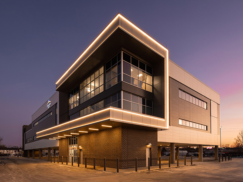 Illuminated entrance of the WellSpan Health outpatient center in Lancaster, PA