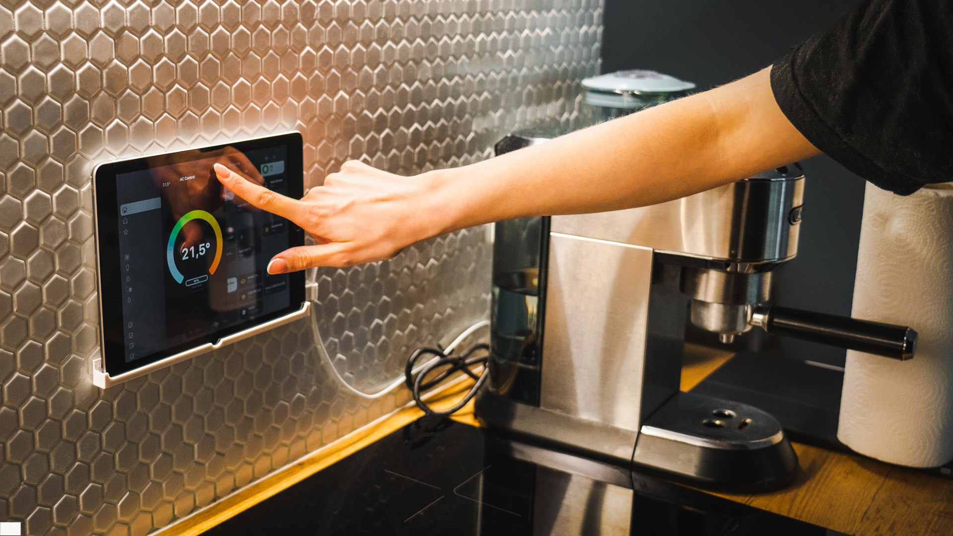 Technician using digital lighting control interface to adjust automated lighting system