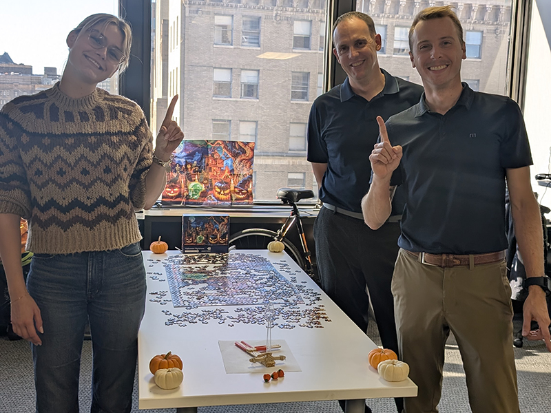Barton Associates team celebrating an ESOP puzzle competition